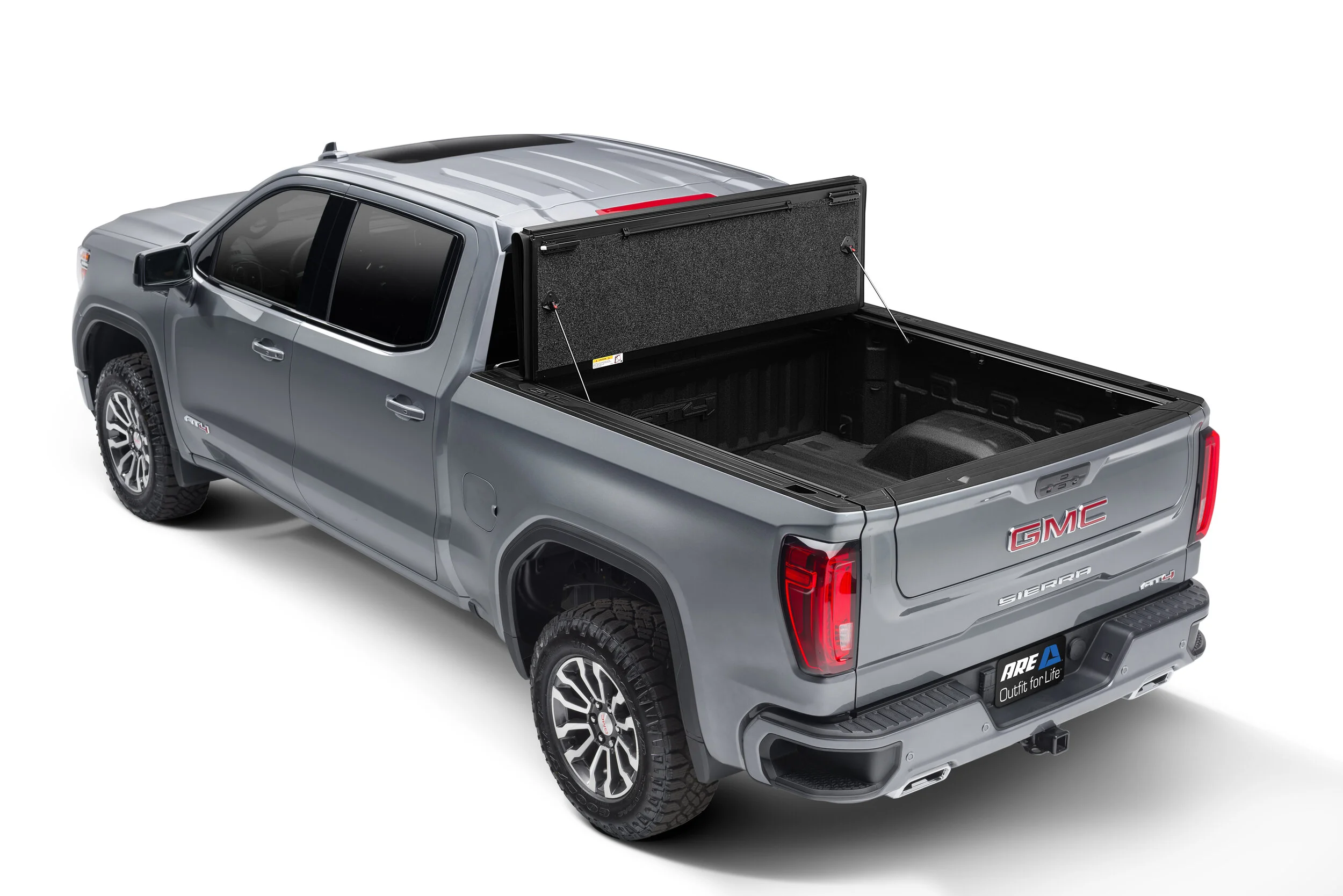 AOR hard folding tonneau cover on a truck bed on a dirt road